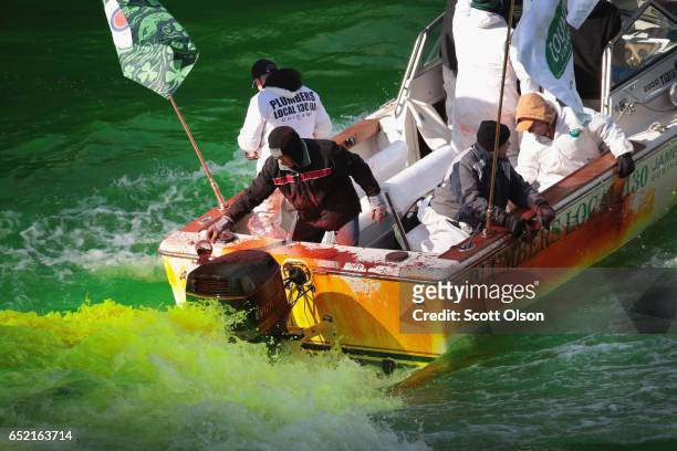 Workers dye the Chicago River green in celebration of St. Patrick's Day on March 11, 2017 in Chicago, Illinois. Dyeing the river has been a St....