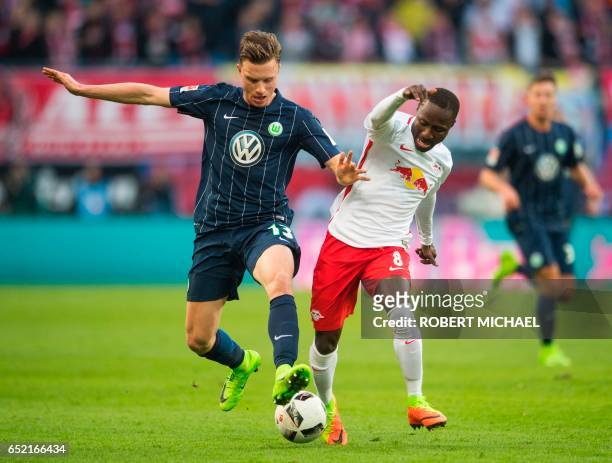 Wolfsburg's midfielder Yannick Gerhardt and Leipzig's Guinean midfielder Naby Deco Keita vie for the ball during the German First division Bundesliga...