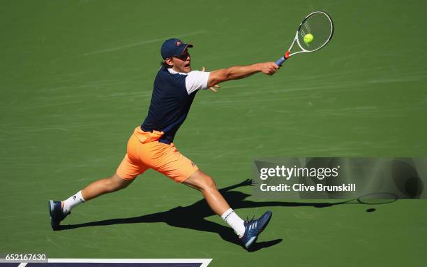 Dominic Thiem of Austria plays a backhand against Jeremy Chardy of France in their second round match during day six of the BNP Paribas Open at...