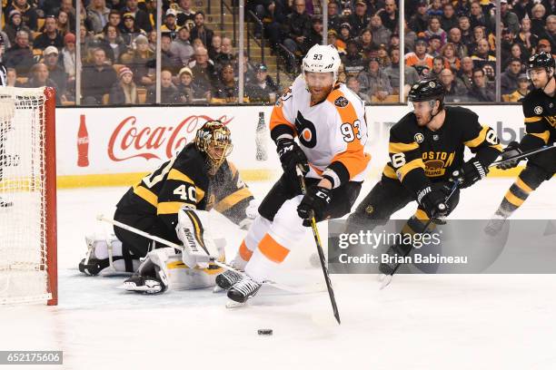 Jakub Voracek of the Philadelphia Flyers fights for the puck against Tuukka Rask of the Boston Bruins at the TD Garden on March 11, 2017 in Boston,...