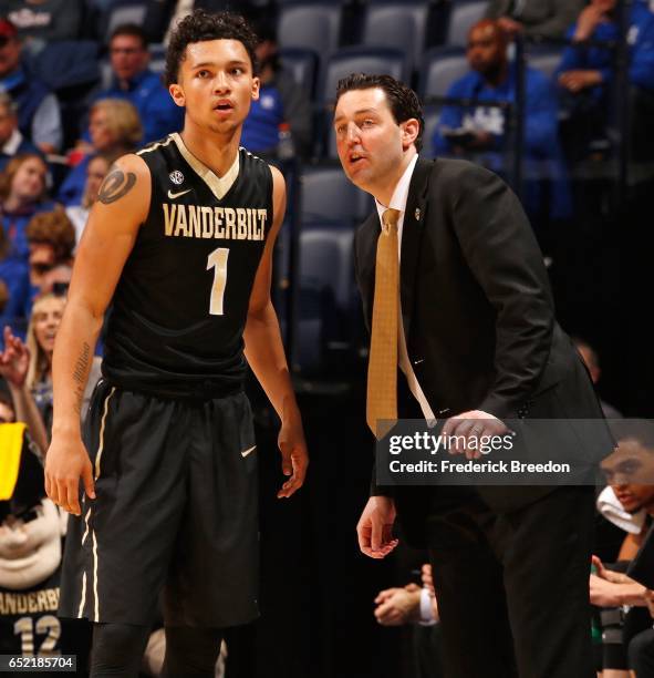 Head coach Bryce Drew of the Vanderbilt Commodores coaches Payton Willis during the first half of an SEC Tournament Semifinal against Arkansas at...