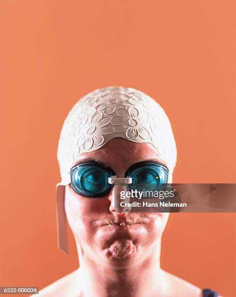 woman making face - swimming cap stock pictures, royalty-free photos & images