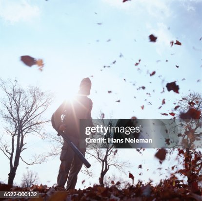 Man Using Leaf Blower Man Using Leaf Blower