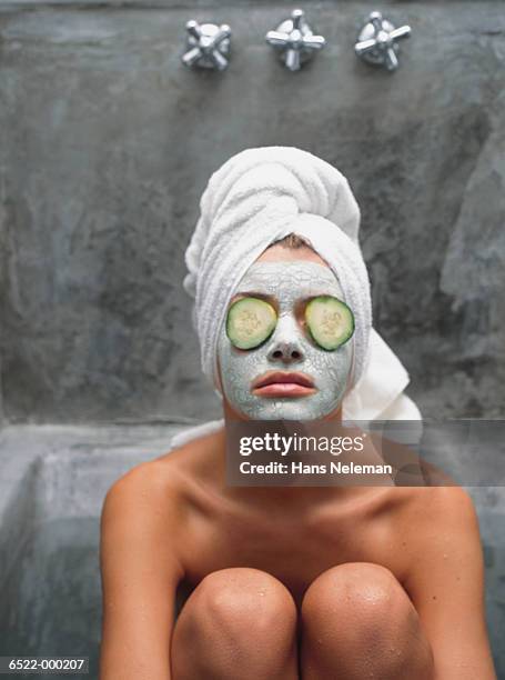 woman wearing face mask - cucumber imagens e fotografias de stock