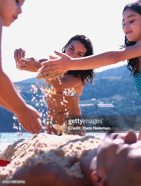 family burying father - burying stock pictures, royalty-free photos & images