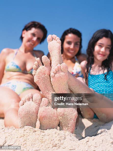 three females on beach - feet girl stock pictures, royalty-free photos & images