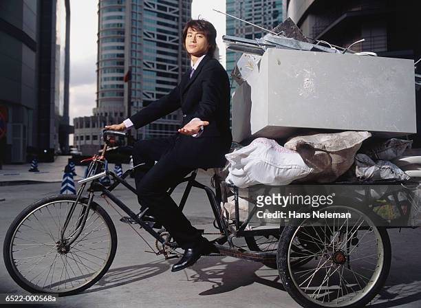 businessman riding rickshaw - trailer trash stock pictures, royalty-free photos & images