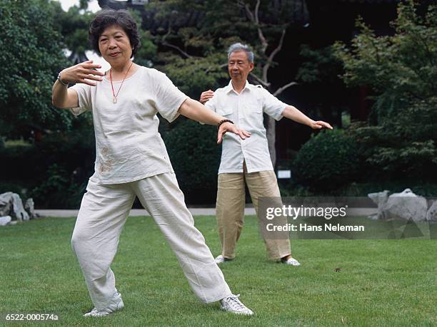 couple doing tai chi - woman and tai chi stock pictures, royalty-free photos & images