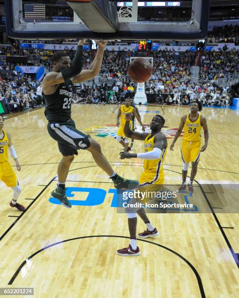 Michigan State Spartans guard Miles Bridges dunks the ball against Minnesota Golden Gophers center Bakary Konate in the third round of the Big 10...