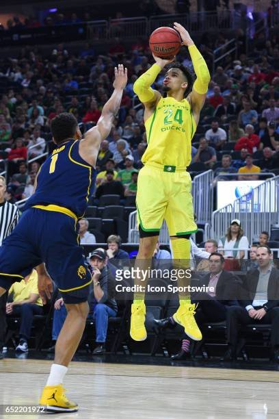 Oregon forward Dillon Brooks shoots a three pointer during the semifinal game of the Pac-12 Tournament between the Oregon Ducks and the California...