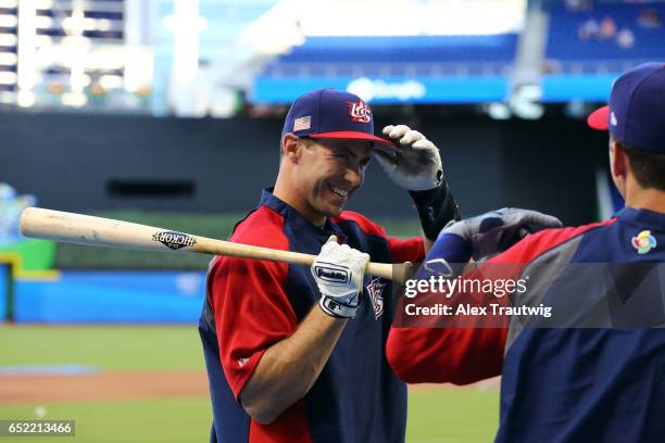 Paul Goldschmidt of Team USA jokes with teammate Buster Posey during batting practice prior to Game 4 Pool C of the 2017 World Baseball Classic...