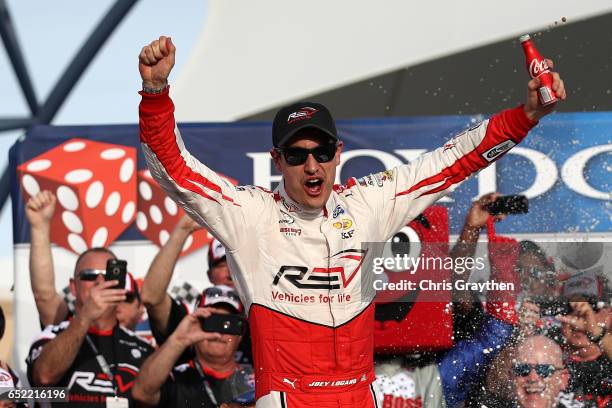 Joey Logano, driver of the REV Ford, celebrates in Victory Lane after winning the NASCAR XFINITY Series Boyd Gaming 300 at Las Vegas Motor Speedway...