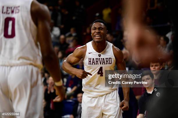 Zena Edosomwan of the Harvard Crimson tries to fire up his team against the Yale Bulldogs during the second half at The Palestra during an Ivy League...