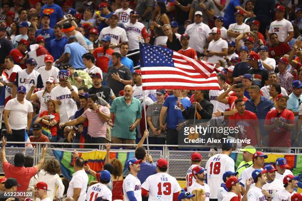 Fans are seen cheering in the stands during Game 4 Pool C of the 2017 World Baseball Classic between Team USA and Team Dominican Republic on...