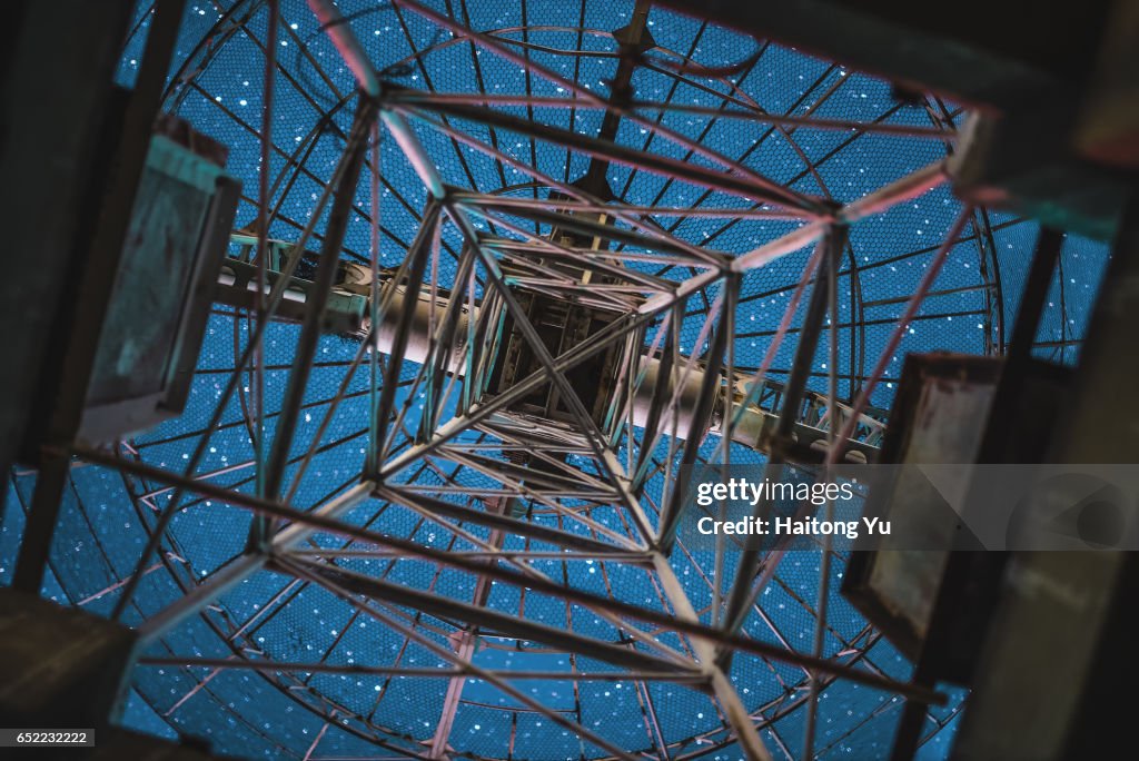 Looking at starry sky from below a radio telescope antenna