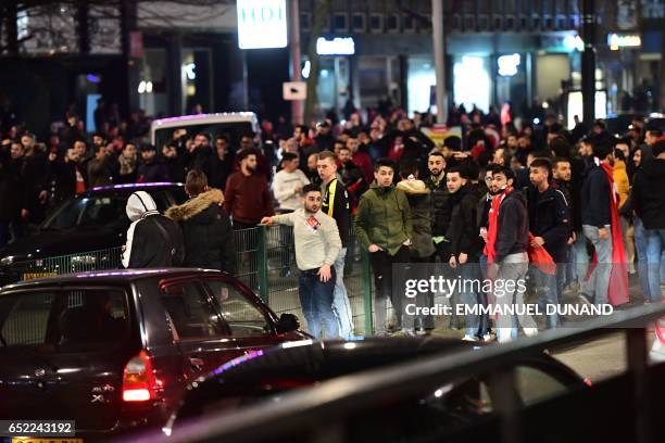 Turkish residents of the Netherlands gather for a protest outside Turkey's consulate in Rotterdam on March 11, 2017. Protests erupted in the Dutch...