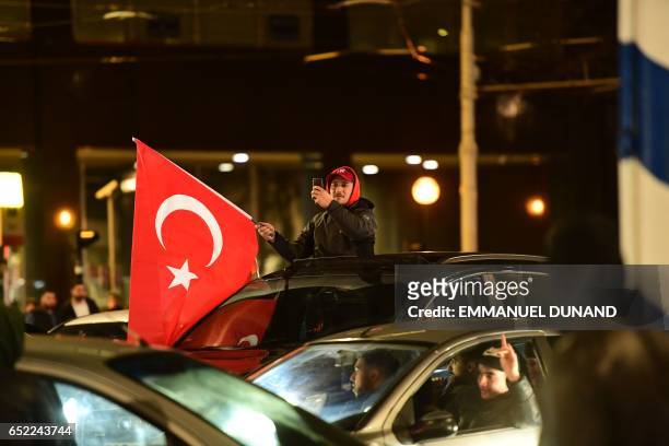 Turkish residents of the Netherlands gather for a protest in Rotterdam on March 11, 2017. Protests erupted in the Dutch port city of Rotterdam late...