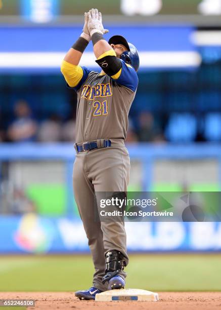 Colombia catcher Jhonatan Solano on a double stands in second base and ask the crow to get up during the eighth inning a game of the WBC between the...