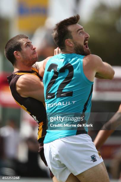 Ben Stratton of the Hawks and Charlie Dixon of the Power competes for the ball during the JLT Community Series match between the Port Adelaide Power...