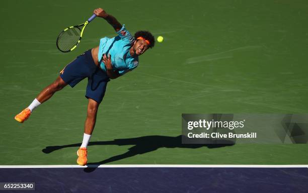 Jo-Wilfried Tsonga of France serves against Fabio Fognini of Italy during day six of the BNP Paribas Open at Indian Wells Tennis Garden on March 11,...