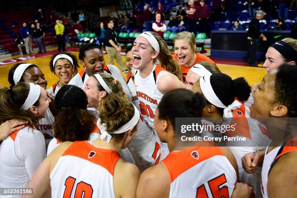 Bella Alarie of the Princeton Tigers elates with her teammates with the win over the Harvard Crimson during an Ivy League semifinal matchup at The...