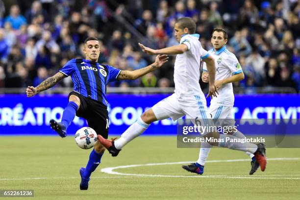 March 11: Adrian Arregui of the Montreal Impact tries to play the ball past Osvaldo Alonso of the Seattle Sounders during the MLS game at Olympic...