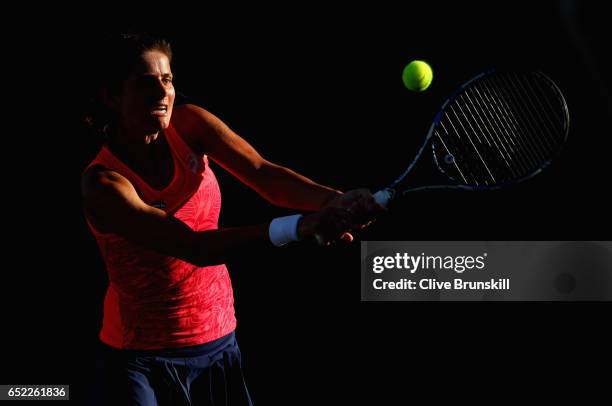 Julia Goerges of Germany plays a backhand against Samantha Stosur of Australia in their second round match during day six of the BNP Paribas Open at...