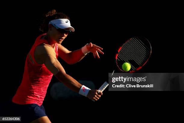 Samantha Stosur of Australia plays a backhand against Julia Goerges of Germany in their second round match during day six of the BNP Paribas Open at...