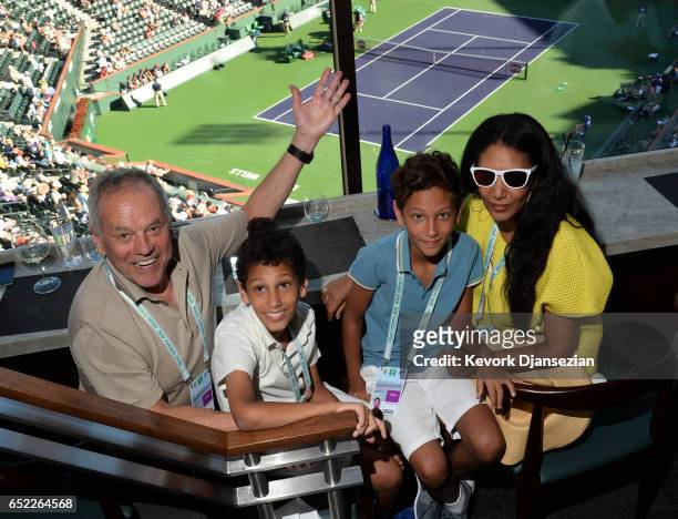 Celebrity chef Wolfgang Puck and wife, designer Gelila Assefa and their children Oliver Puck and Alexander Puck pose inside Spago restaurant...