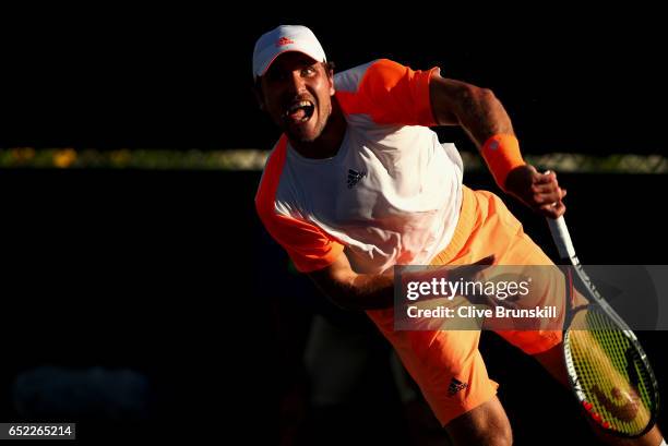 Mischa Zverev of Germany serves against Joao Sousa of Portugal in their second round match during day six of the BNP Paribas Open at Indian Wells...