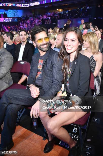 Actors John Stamos and Caitlin McHugh pose at Nickelodeon's 2017 Kids' Choice Awards at USC Galen Center on March 11, 2017 in Los Angeles, California.