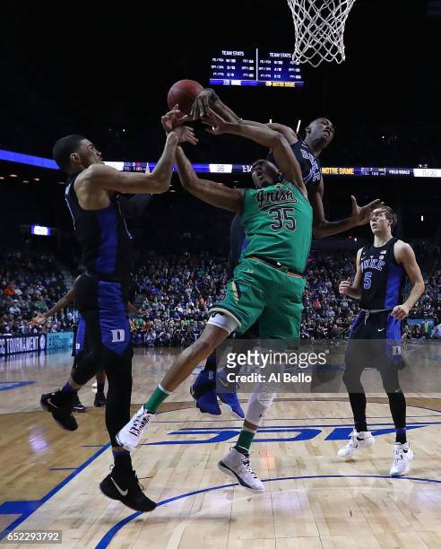 Bonzie Colson of the Notre Dame Fighting Irish battles against Jayson Tatum and Harry Giles of the Duke Blue Devils during the championship game of...