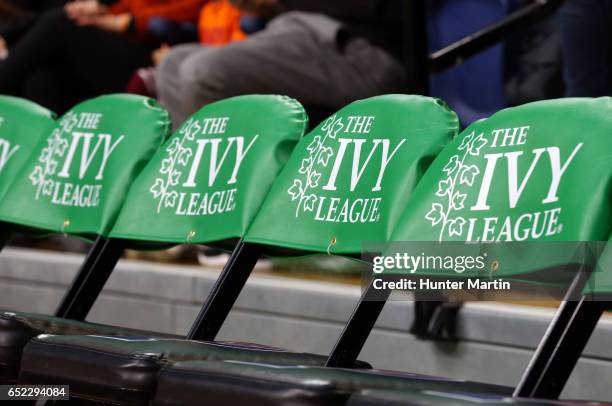 The Ivy League logo is displayed on chairs on the players bench during a game between the Princeton Tigers and the Pennsylvania Quakers at The...