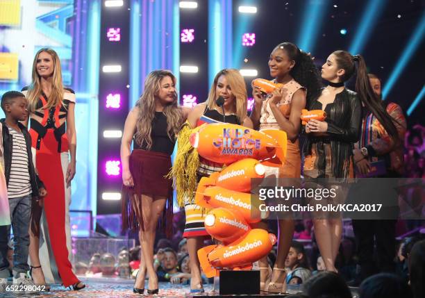 Singers Lauren Jauregui, Dinah Jane Hansen, Normani Kordei and Ally Brooke of Fith Harmony accept the award for Favorite Music Group from presenter...