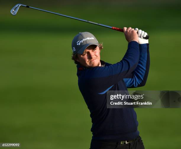Eddie Pepperell of England plays a shot during the continuation of the delayed third round the Hero Indian Open at Dlf Golf and Country Club on March...