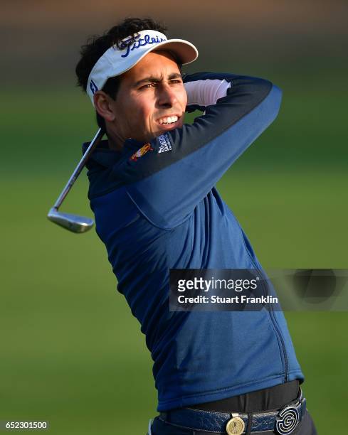 Carlos Pigem of Spain plays a shot during the continuation of the delayed third round the Hero Indian Open at Dlf Golf and Country Club on March 12,...