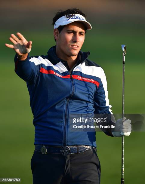 Carlos Pigem of Spain reacts to a shot during the continuation of the delayed third round the Hero Indian Open at Dlf Golf and Country Club on March...