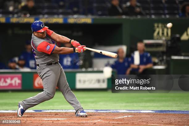 Alfredo Despaigne of Cuba hits a homer on a line drive to left center field in the second inning during the World Baseball Classic Pool E Game One...