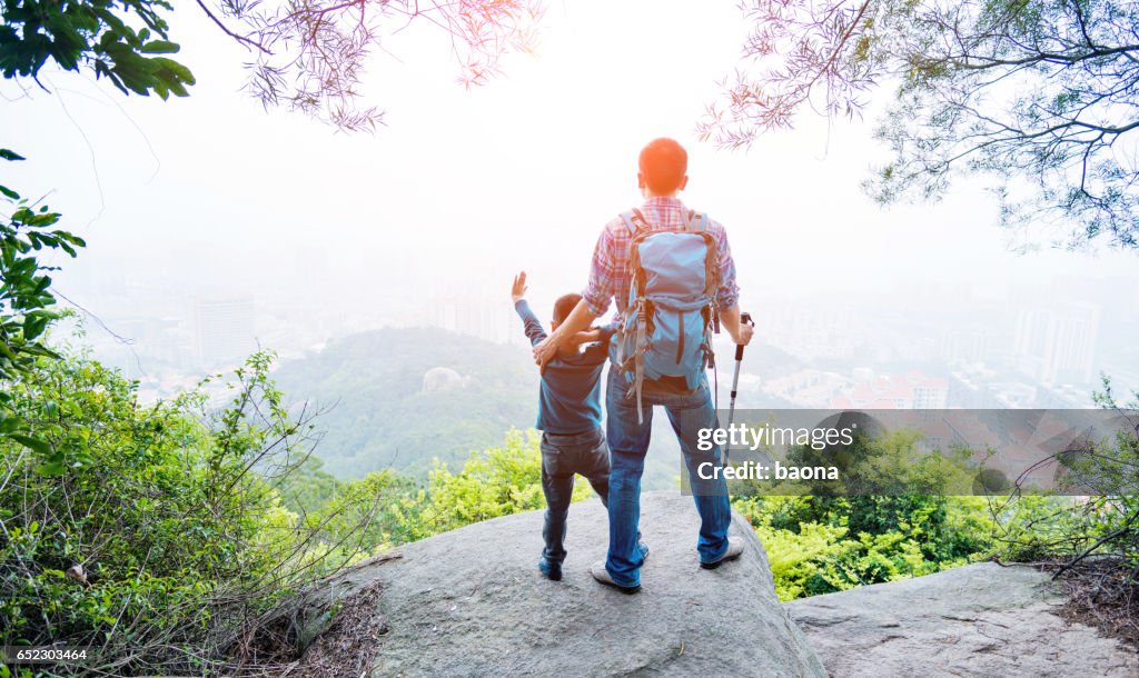 Father and son on the top of the hill