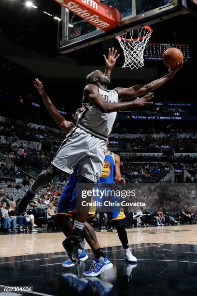 Joel Anthony of the San Antonio Spurs shoots a lay up against the Golden State Warriors on March 11, 2017 at the AT&T Center in San Antonio, Texas....