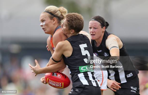 Phoebe McWilliams of the Giants is tackled by Emma Grant of the Magpies during the round six AFL Women's match between the Collingwood Magpies and...