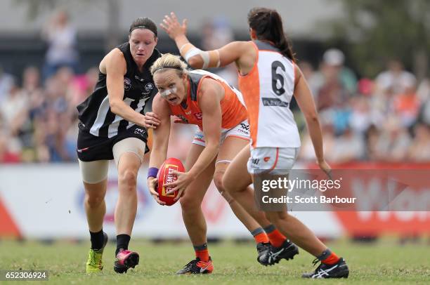 Phoebe McWilliams of the Giants is tackled during the round six AFL Women's match between the Collingwood Magpies and the Greater Western Sydney...