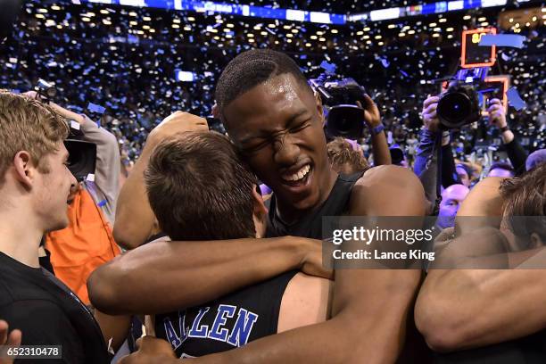 Harry Giles hugs Grayson Allen of the Duke Blue Devils following their 75-69 victory against the Notre Dame Fighting Irish during the ACC Basketball...