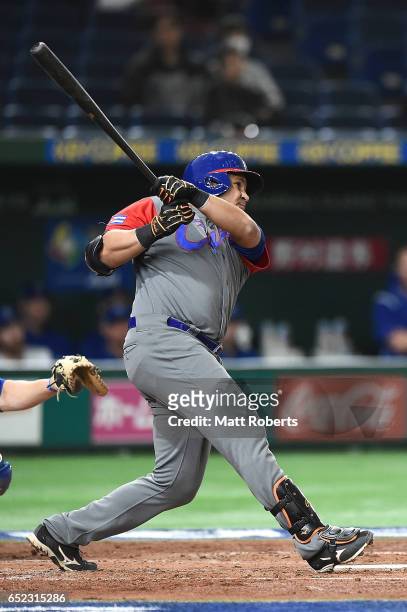 Frederich Cepeda of Cuba flies out to center in the third inning during the World Baseball Classic Pool E Game One between Cuba and Israel at Tokyo...