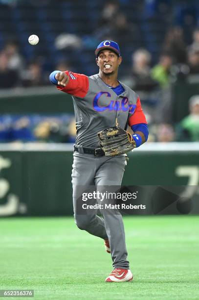 Yurisbel Gracial of Cuba catches the grounder by Sam Fuld of Israel and throws to William Saavedra of Cuba to tag out in the third inning during the...