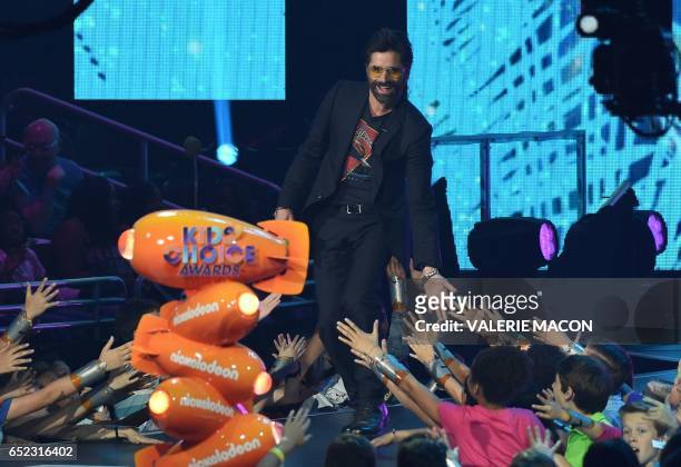 John Stamos on stage at the 30th Annual Nickelodeon Kids' Choice Awards, March 11 at the Galen Center on the University of Southern California campus...