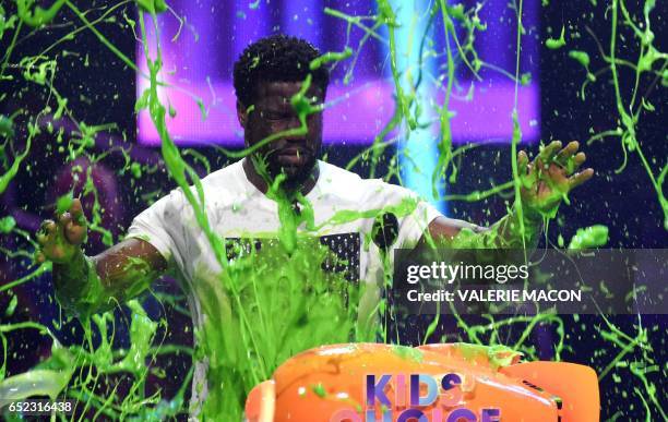 Kevin Hart gets slimed on stage at the 30th Annual Nickelodeon Kids' Choice Awards, March 11 at the Galen Center on the University of Southern...