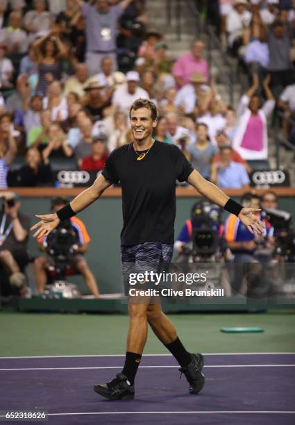 Vasek Pospisil of Canada celebrates match point against Andy Murray of Great Britain in their second round match during day six of the BNP Paribas...