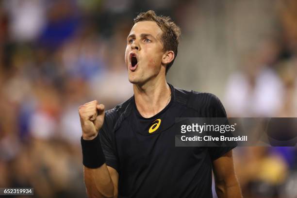 Vasek Pospisil of Canada celebrates a point during his straight sets victory against Andy Murray of Great Britain in their second round match during...