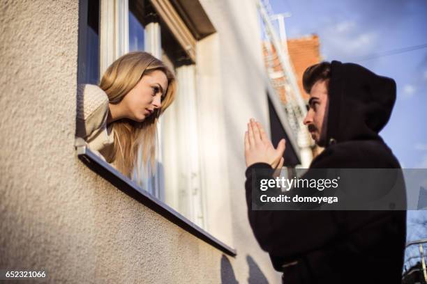 man begging  his girlfriend to forgive him - reunites stock pictures, royalty-free photos & images